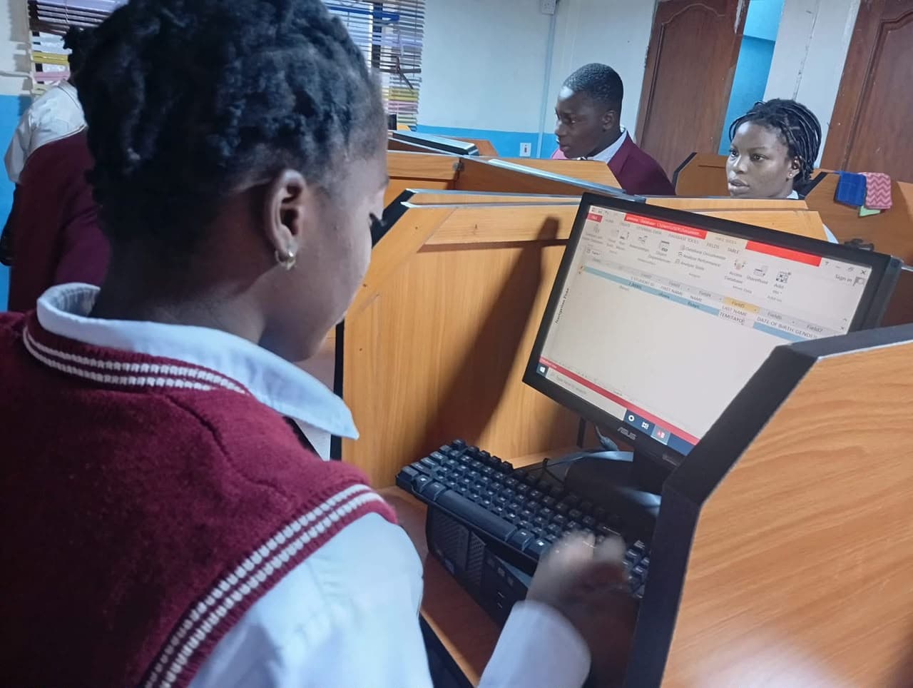 A student working at a computer in the ICT lab