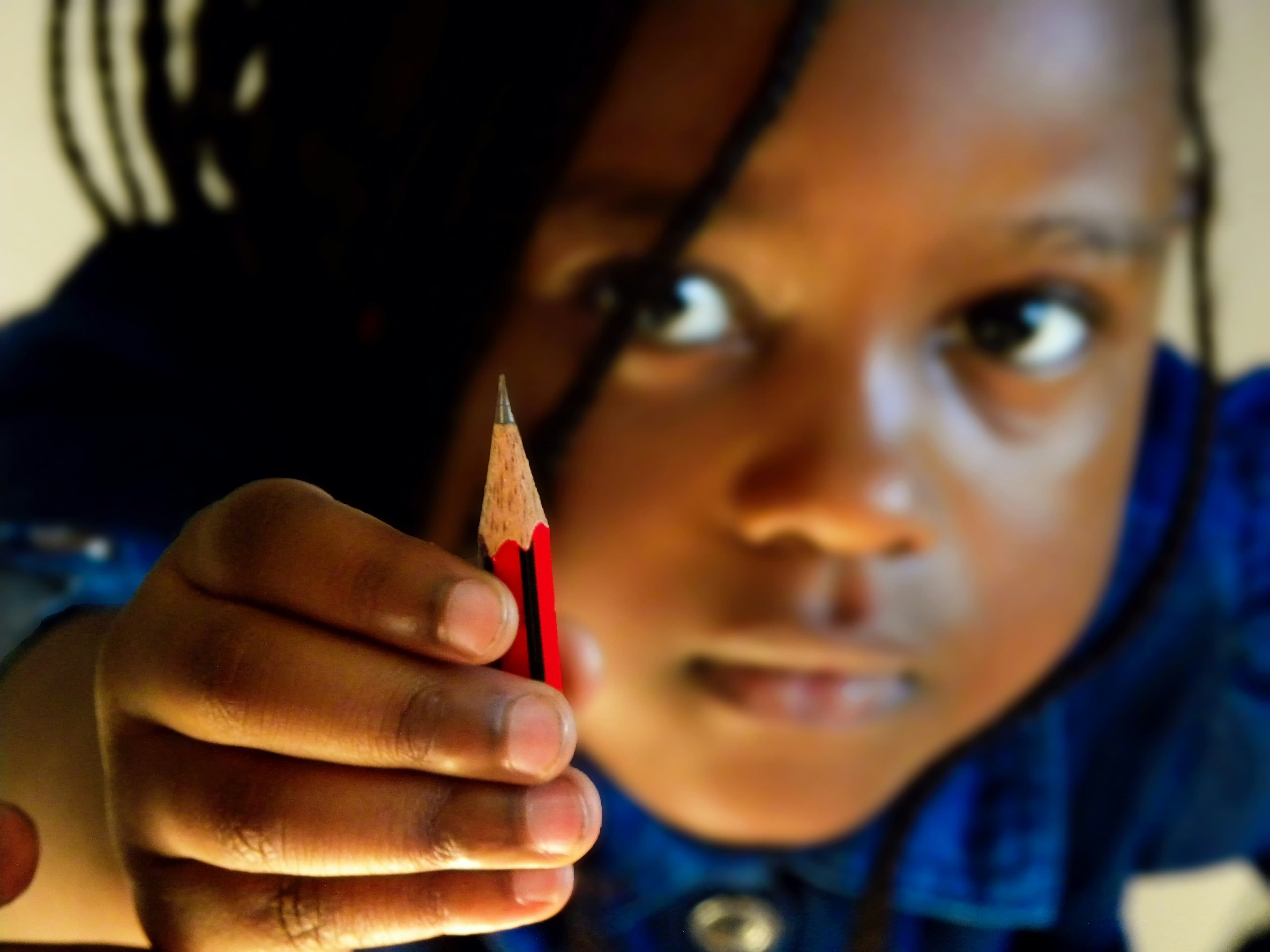 A Joef Dynamic student concentrating with a pencil in hand